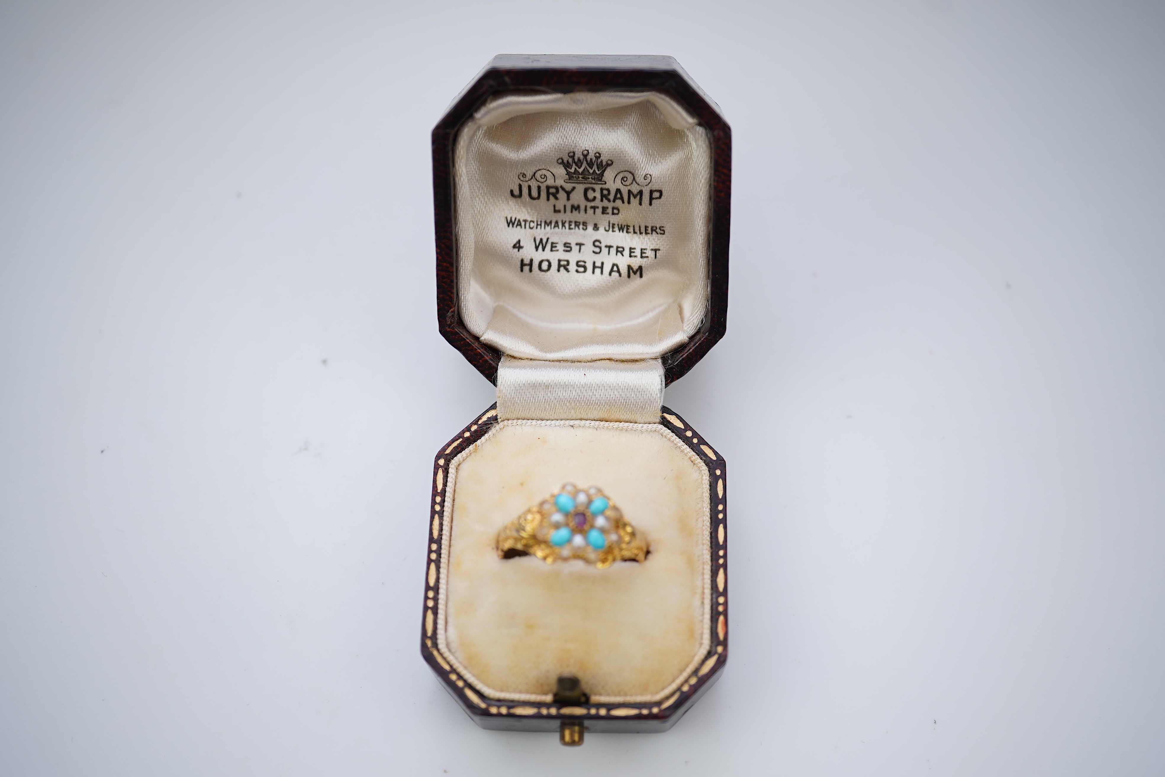 A late Georgian garnet, pearl and turquoise ring, circa 1830